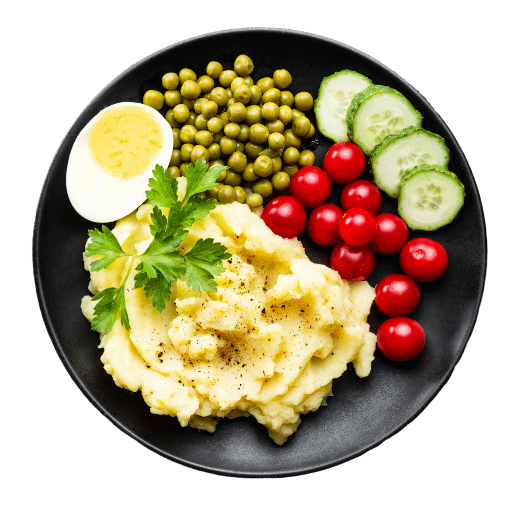 Ausgewogenes Schul- und Kitaessen mit Kartoffelpüree, Erbsen, frischem Gemüse und Ei – geliefert von Aubergine & Zucchini in Meckenheim
